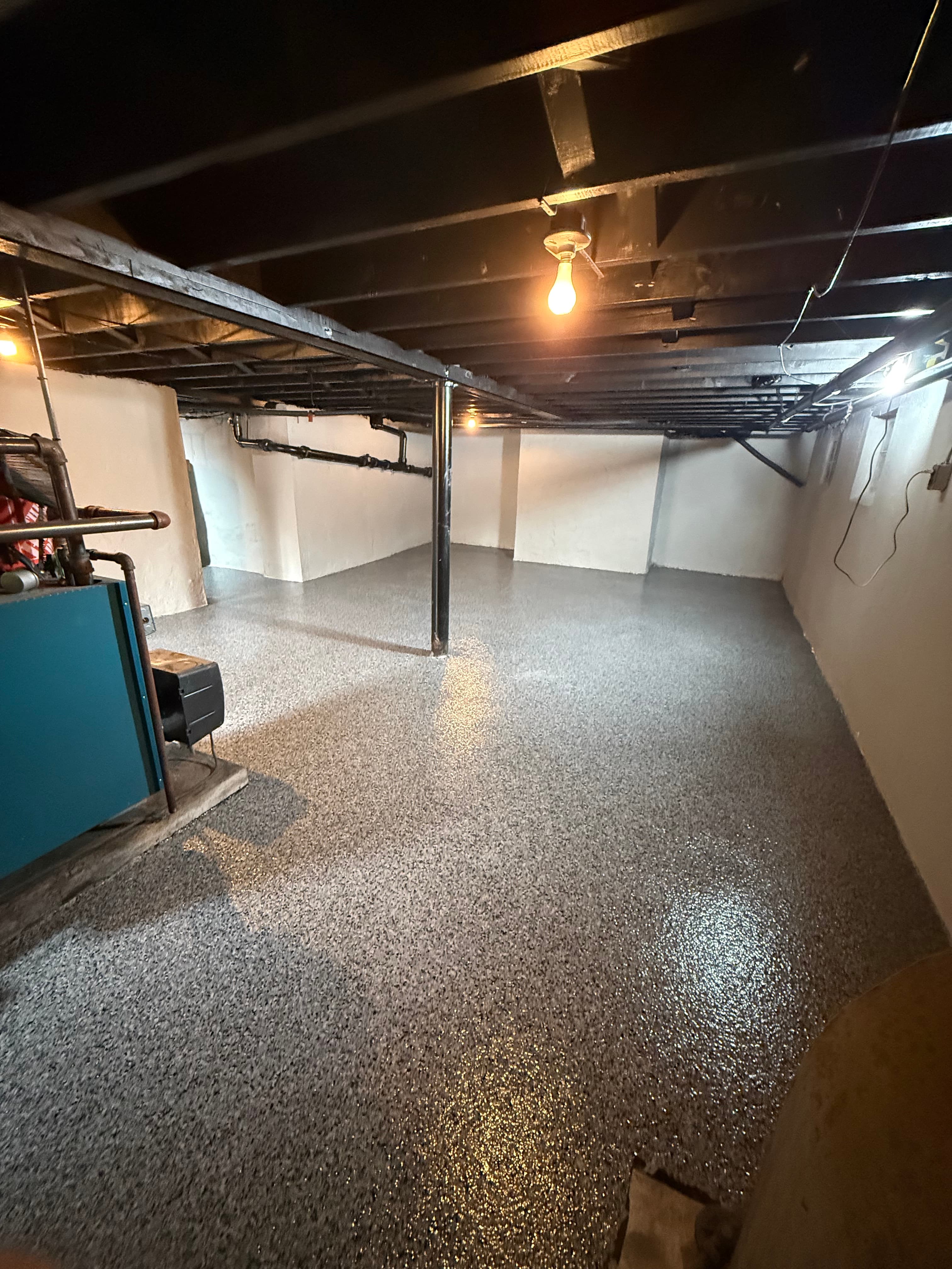 Finished basement with flake epoxy floor coating